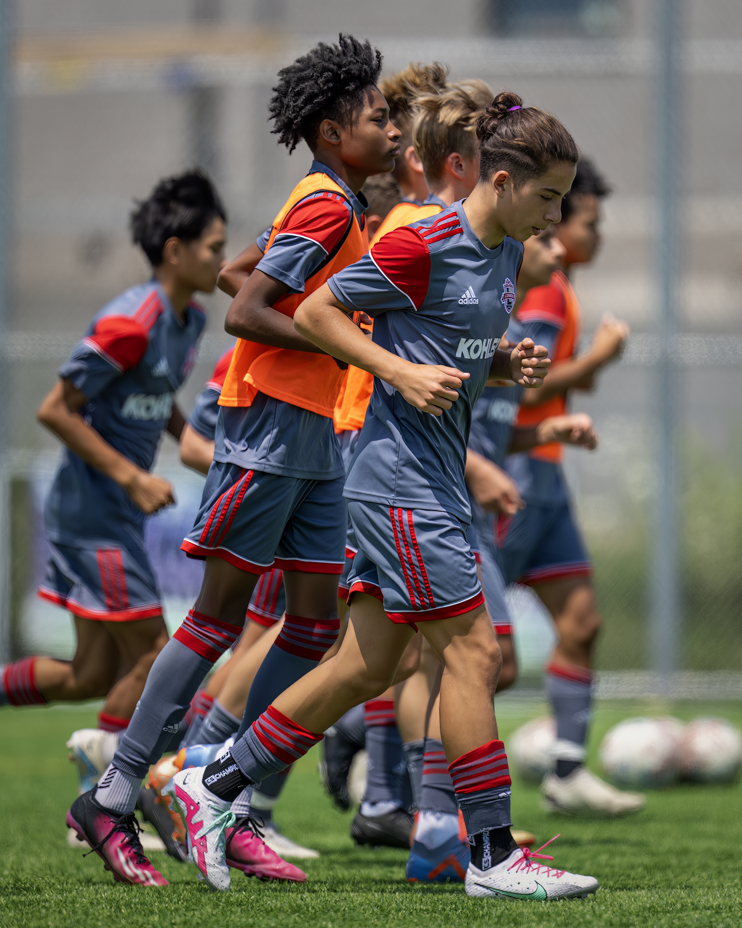 Youth soccer squad warming up before a session